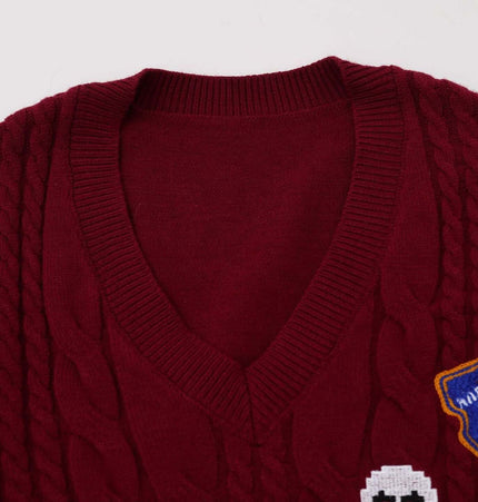 Embroidered Cable Knit VNeck Sweater with detailed V-neckline and textured knit design.
