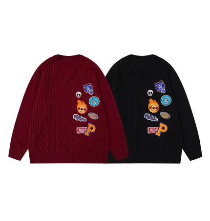 Embroidered Cable Knit VNeck Sweater in burgundy and black, featuring unique heavy embroidery and a textured cable-knit pattern.