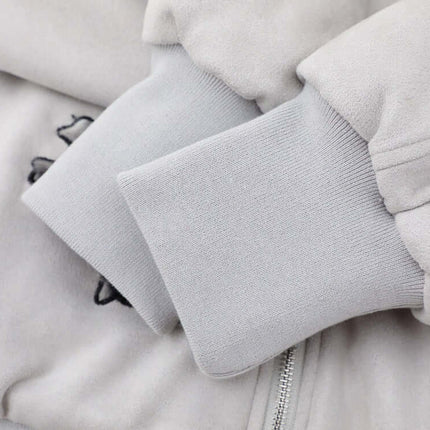 Close-up of the cuffs on the Embroidered Hooded Coat – Loose Fit, showcasing the soft fabric and embroidery detail.