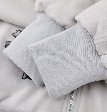 Close-up of the cuffs on the Embroidered Hooded Coat – Loose Fit, showcasing the soft fabric and embroidery detail.