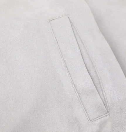 Embroidered Hooded Coat – Loose Fit with a close-up of the pocket detail on the fabric.