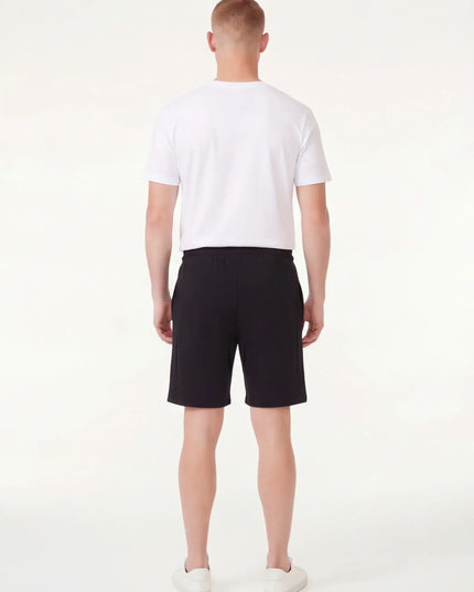 Rear view of the Maison Grozavu Ash Top Edition in top — showing the effortless drape.