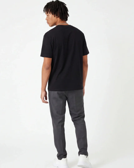 Rear view of the Maison Grozavu Tailored Alabaster Tee in shirt — showing the sleek silhouette.