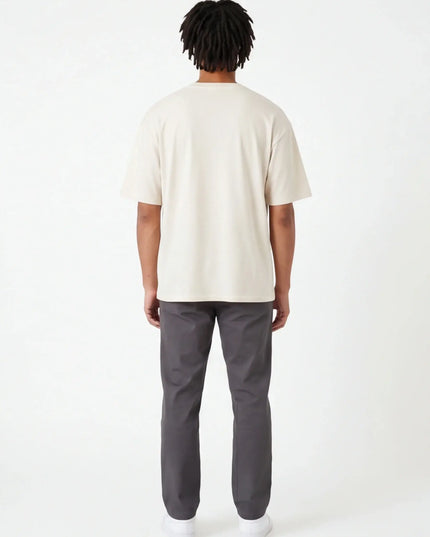 Rear view of the Maison Grozavu Tailored Alabaster Tee in shirt — showing the clean lines.