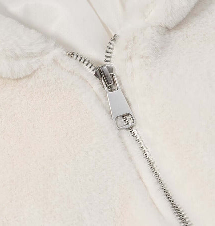 Close-up of the zipper on a cozy Faux Fur Hooded Winter Coat for Women, showcasing its soft fabric and stylish detail.
