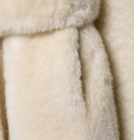 Close-up of soft textile texture of the Faux Fur Waistcoat Jacket – Slim Fit in classic white.