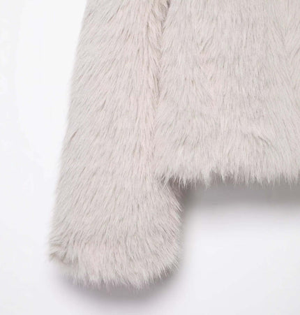 Close-up of the soft faux fur texture of the Faux Fur Zipper Coat – Elegant Fit in classic white.