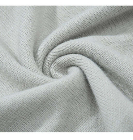 Close-up of soft fabric showcasing the texture of the Faux Layered Knit Sweater with Collar.