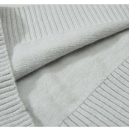 Close-up of Faux Layered Knit Sweater with Collar showing soft fabric and wide ribbing design.