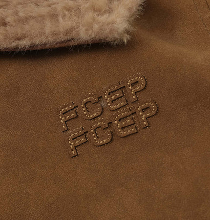 Close-up of the Faux Suede Fur Collar Jacket – Loose Fit showing plush fur collar and stylish appliqué design.