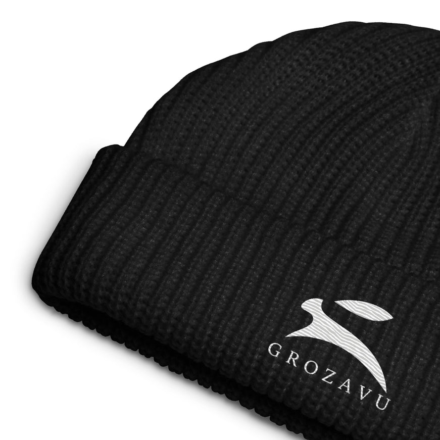 Close-up of the embroidered Grozavu hare and wordmark on the black fisherman beanie