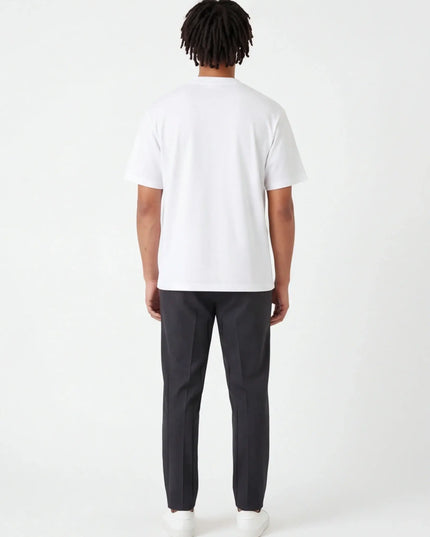 Rear view of the Maison Grozavu Sleek Carbon Tee in shirt — showing the effortless drape.