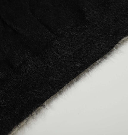 Fleece Letter Pullover Sweater – Loose Fit close-up showing texture and color contrast of black and white fabric.