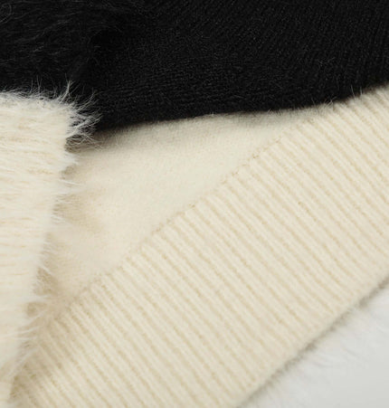 Fleece Letter Pullover Sweater – Loose Fit fabric detail showing soft textures in black and cream colors.