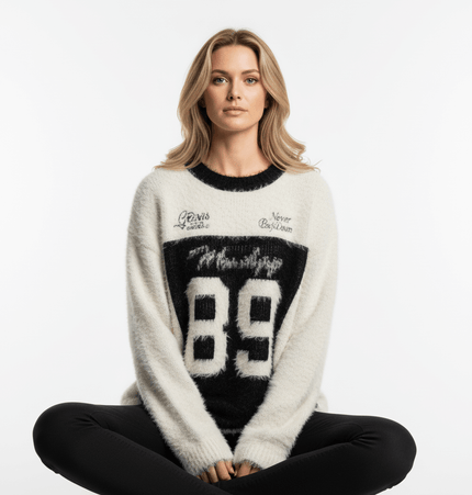 Fleece Letter Pullover Sweater – Loose Fit in black and white with number 89 and street graphics, worn by a woman.