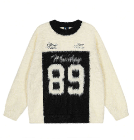Fleece Letter Pullover Sweater – Loose Fit in cream with black letter graphics, round neckline, and relaxed fit.