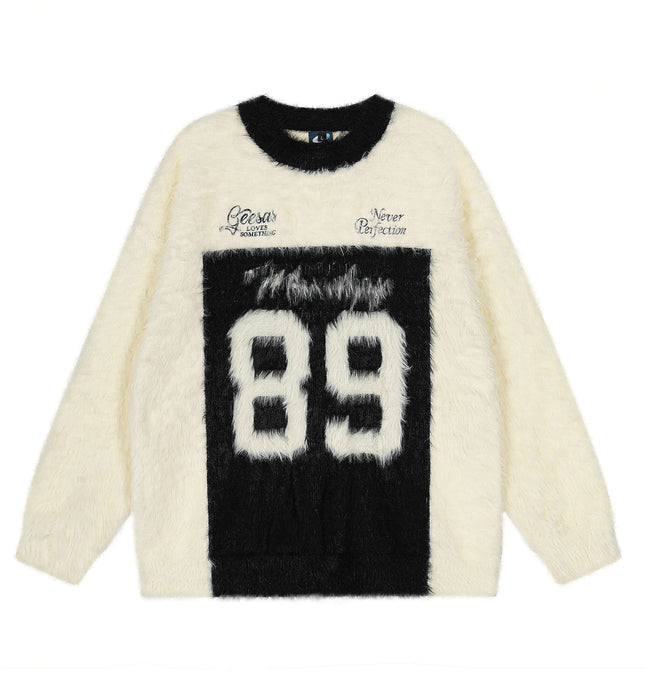 Fleece Letter Pullover Sweater – Loose Fit in cream with black letter graphics, round neckline, and relaxed fit.
