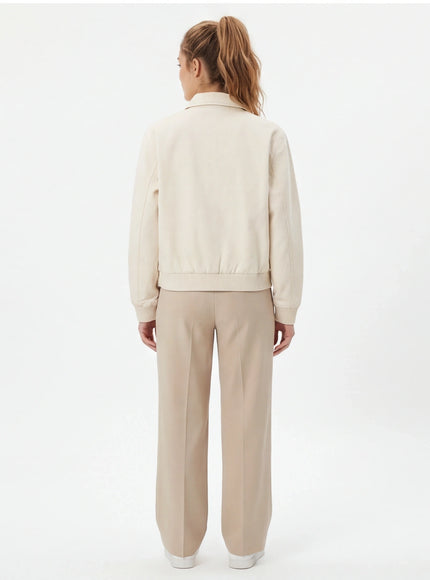 Model wearing Apricot cropped tailored jacket by Grozavu