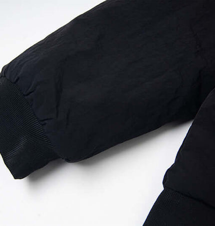 Detail of the sleeve of the Fur Collar Embroidered Hooded Cotton Coat showcasing its design and fabric.