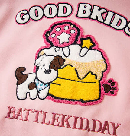 Detail of Letter Embroidery Colorblock Jacket featuring playful animal design, cake, and bold lettering.