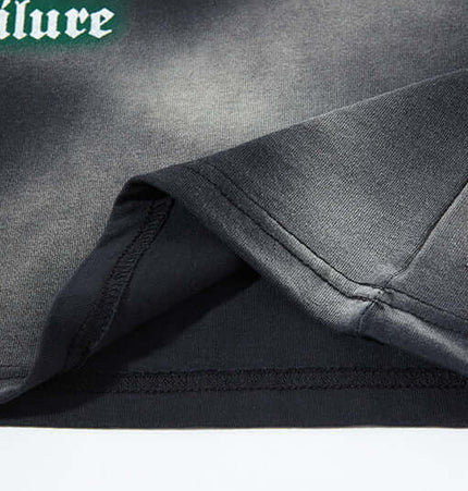 Close-up of the sleeve hem detail of the Graffiti Butterfly Print Tank Top - Loose Fit showcasing fabric quality.