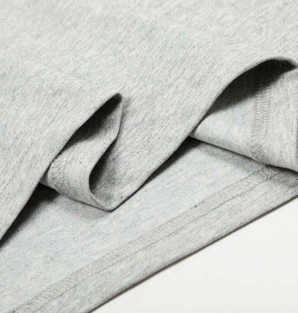 Close-up of the fabric details of the Graffiti Letter Print TShirt – Loose Fit, showcasing the soft cotton blend texture.