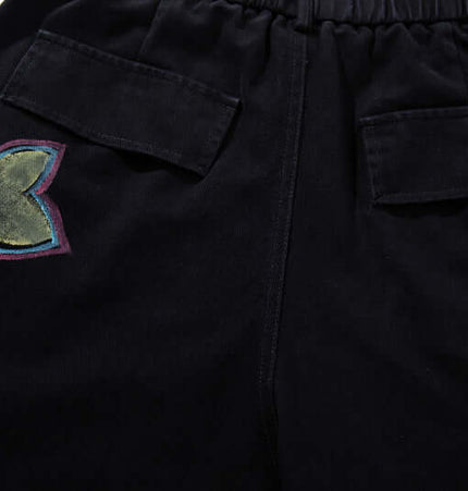 Graffiti Printed Cargo Denim Pants featuring colorful hand-painted flower design on the back pocket.