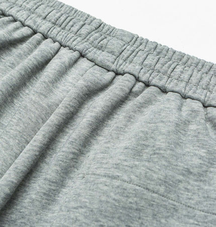 Close-up of the waistband of Letter Print Casual Pants – Loose Fit in soft grey fabric.