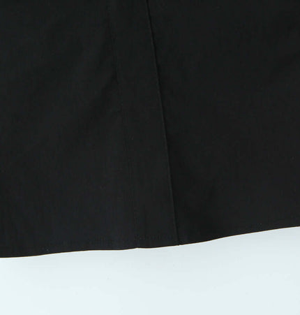 Grid-Stitched Strapless Tank Top – Slim Fit detailed view showing the black fabric and design elements.