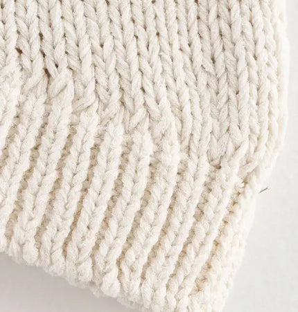 Close-up of the stitching texture of the Asymmetrical Chain Knit Tank Top – Slim Fit in soft knitted fabric.