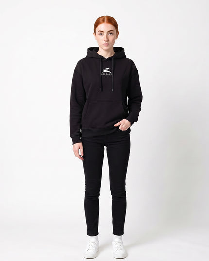 Straight-on front full-body view of model Sienna wearing GROZAVU Black Hoodie in seamless white studio