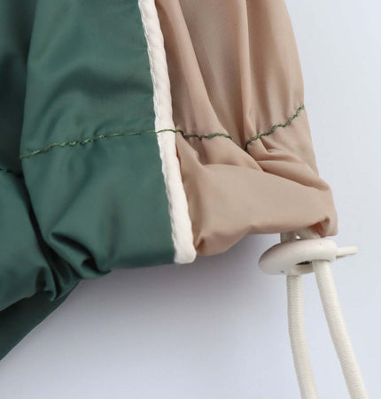 Detail of the Color Block Jacket and Long Pants Set showcasing the unique sleeve design and drawstring feature.