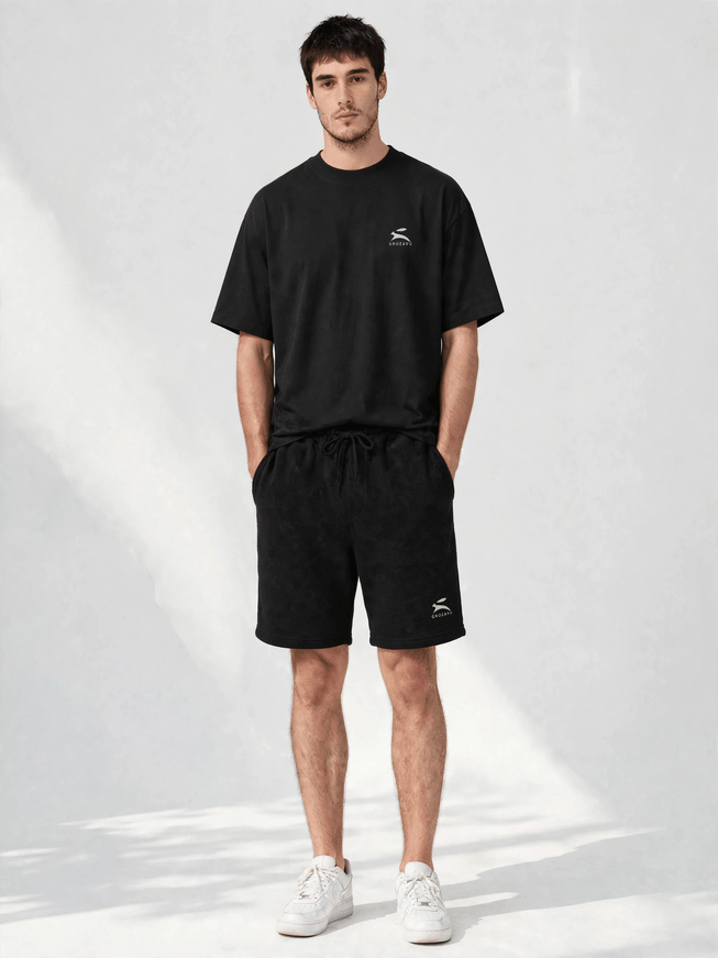Black 280 g/m² cotton fleece shorts, full-body view
