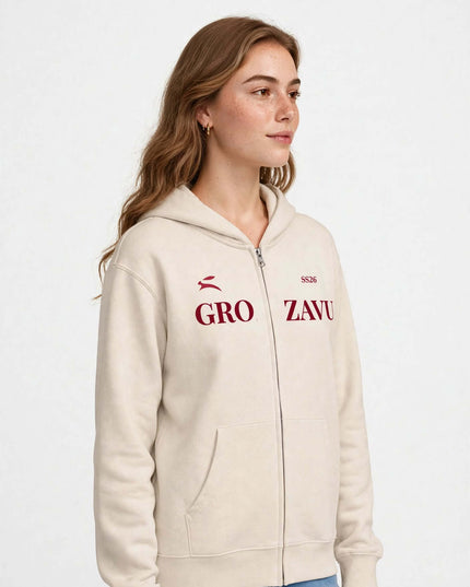 Side profile of the beige full-zip hoodie, relaxed side-seamed fit