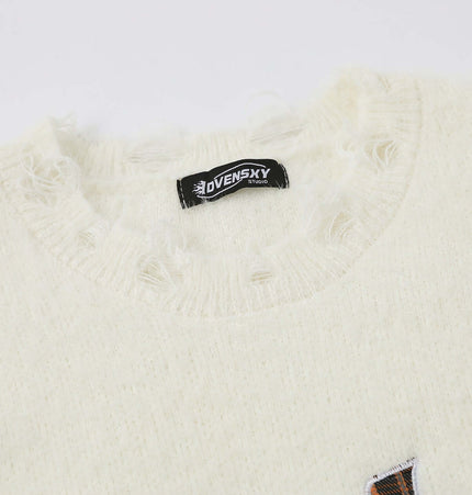 Knit Sweater with Letter Applique collar detail showcasing brand tag and texture.