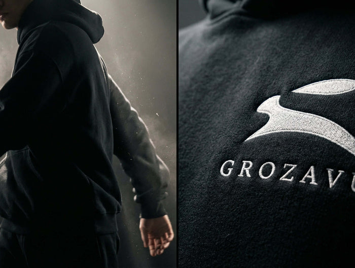 Model wearing the latest Grozavu premium streetwear collection in a modern urban setting