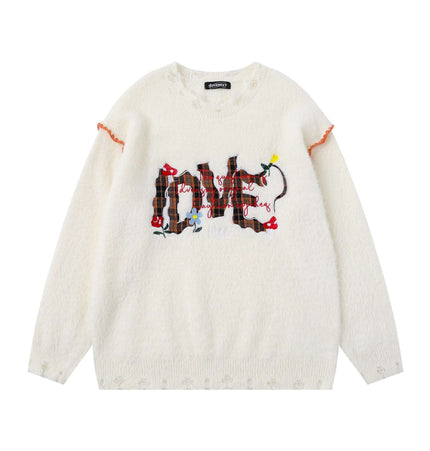 Knit Sweater with Letter Applique featuring bold hand-stitched designs on a soft plaid-textured knit surface.