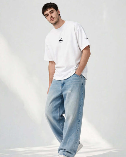 Low-angle shot of the white wide collar tee with dropped shoulders