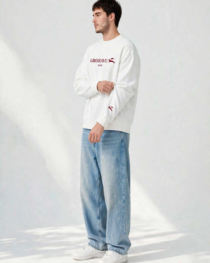 Sleeve logo detail on the white 350 g/m² organic cotton crewneck