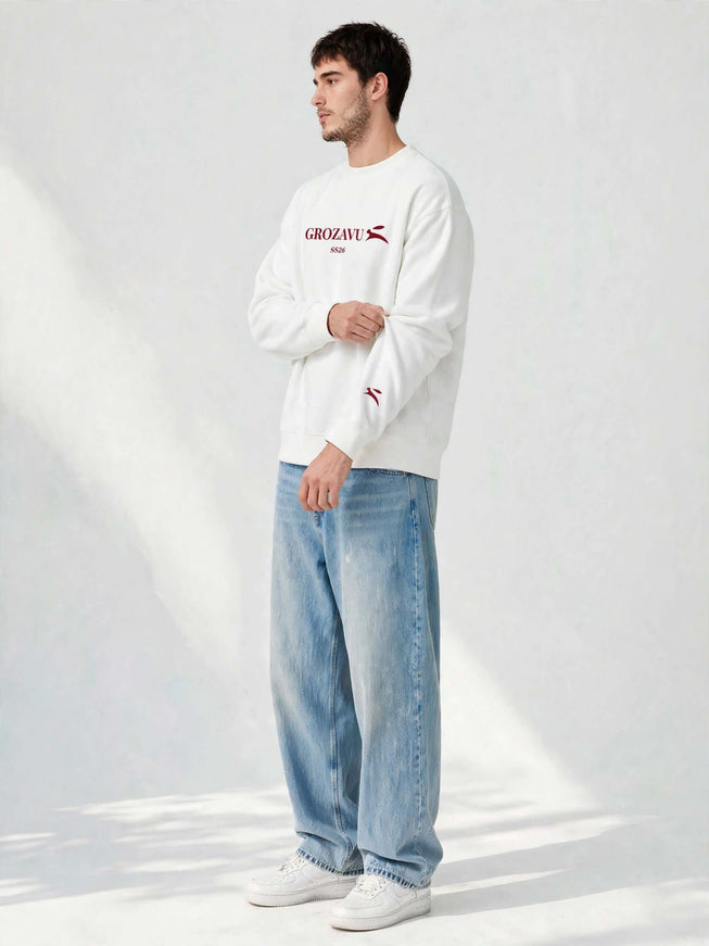 Sleeve logo detail on the white 350 g/m² organic cotton crewneck