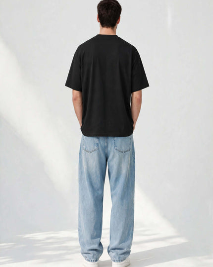 Back view of the black oversized organic tee in GOTS organic cotton