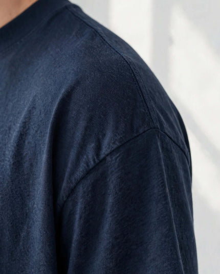 Macro of the 200 g/m² GOTS organic cotton knit on the navy tee