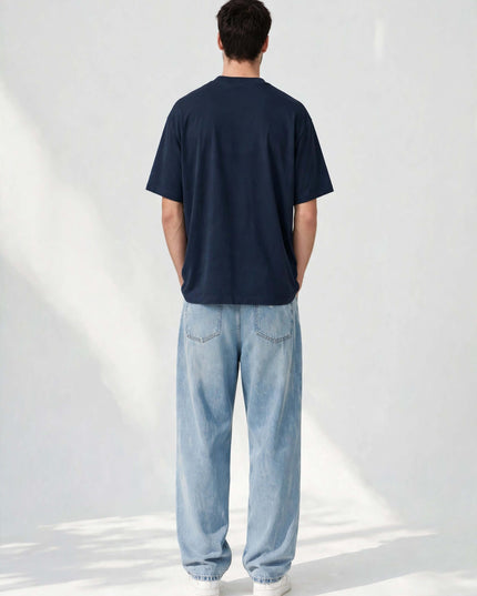 Back view of the navy oversized organic tee showing the wide collar