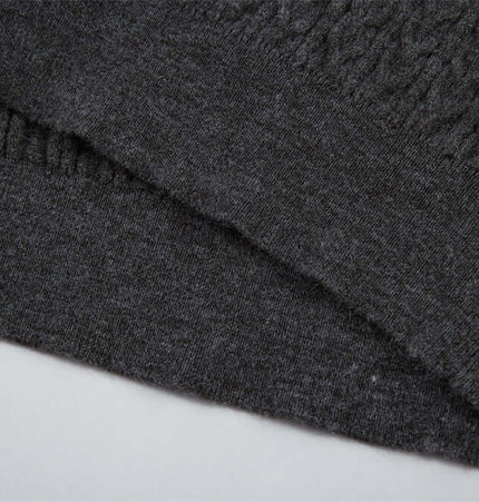 Close-up of the fabric texture of the Polo Collar Knit Pullover Sweater – Fitted in dark gray.