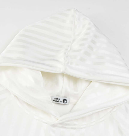 Retro Dark Stripe Patchwork Hoodie featuring a soft white fabric with subtle dark stripes and a stylish hood.
