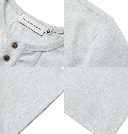 Five-Button Henley TShirt – Loose Fit, featuring a classic round neckline and soft grey fabric with button details.