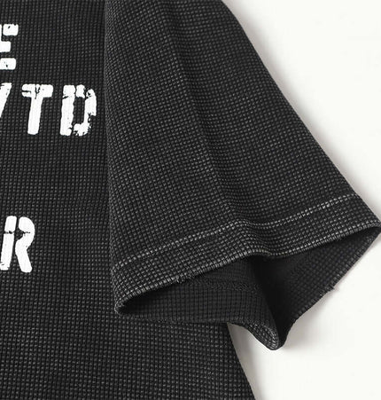 Close-up of the sleeve and textured fabric of the Retro Waffle Washed Cotton TShirt.