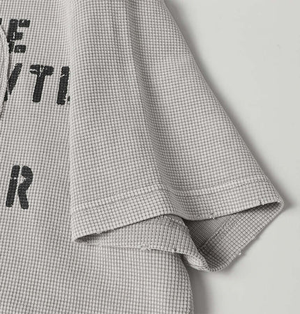 Close-up of the Retro Waffle Washed Cotton TShirt showing textured fabric and relaxed fit.