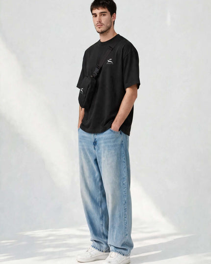 Three-quarter portrait wearing the black nylon taslan sling bag