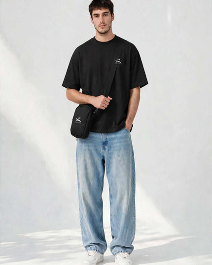 Sling bag worn at the hip on the adjustable strap
